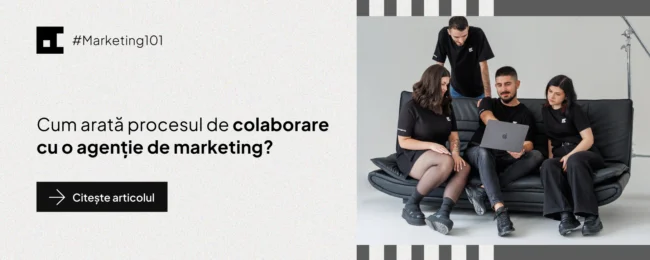 Promo banner for Marketing101 article: a team of four in black shirts sits on a couch, looking at a laptop in a studio setting.